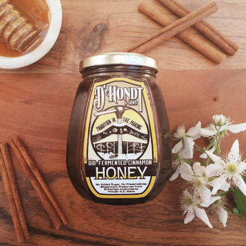 A jar of Bio-Fermented Cinnamon Honey with raw, unfiltered Nelson honey and bio-fermented organic cinnamon, known for its antioxidant-rich properties and health benefits.