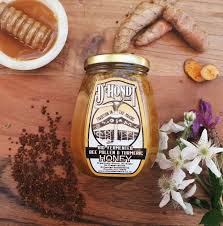 Glass jar of Bio-Fermented Full Spectrum Honey by D’Hondt & Sons with turmeric, ginger, cinnamon, and bee pollen